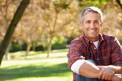 man smiling with all-on-4 dental implants from Central Virginia Family Dentistry