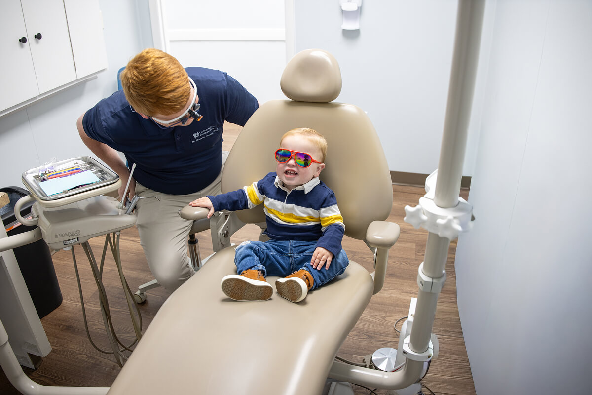 Dr. Benjamin Curling with a child in the exam chair at Central Virginia Family Dentistry