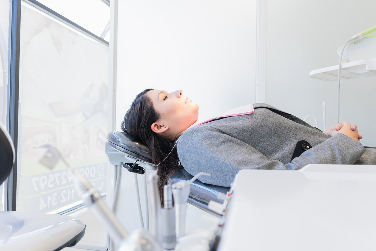Female patient laying in the exam chair at Central Virginia Family Dentistry